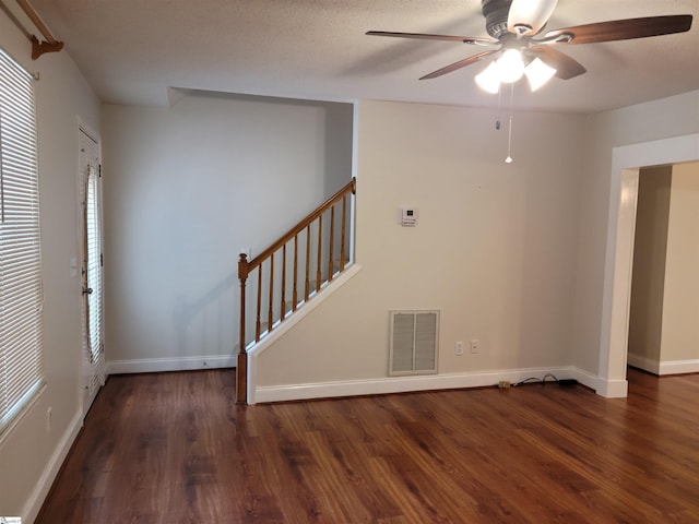 1002 Still Holllow Ln, Taylors, SC 29687 - unfurnished room featuring wood finished floors, a ceiling fan, baseboards, and stairs