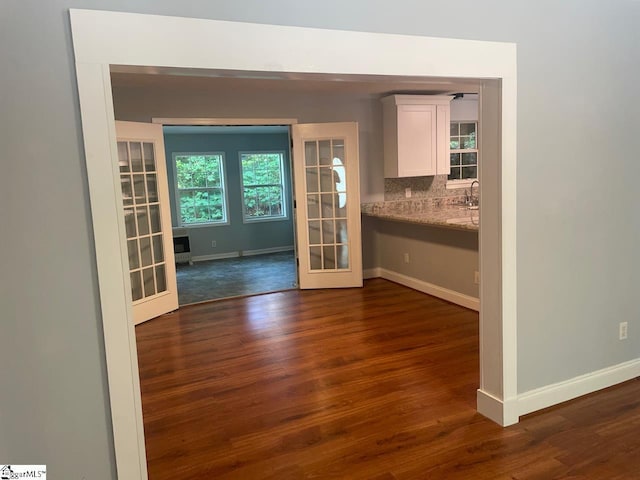1002 Still Holllow Ln, Taylors, SC 29687 - kitchen featuring french doors, baseboards, dark wood-style flooring, and white cabinets
