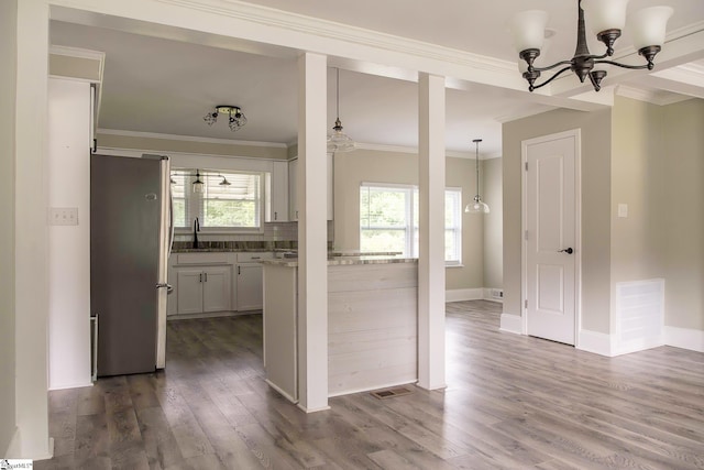 418 N Alabama Ave, Chesnee, SC 29323 - kitchen featuring freestanding refrigerator, a chandelier, dark wood finished floors, ornamental molding, and baseboards