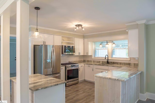 418 N Alabama Ave, Chesnee, SC 29323 - kitchen featuring appliances with stainless steel finishes, open shelves, a peninsula, a sink, and light stone countertops