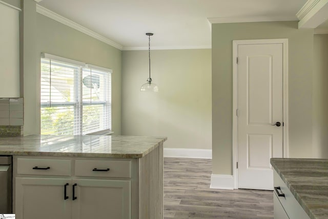 418 N Alabama Ave, Chesnee, SC 29323 - kitchen featuring light wood-style flooring, white cabinets, crown molding, light stone countertops, and baseboards