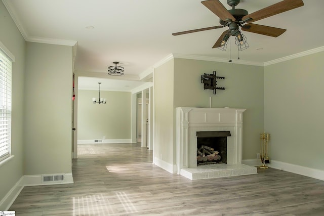 418 N Alabama Ave, Chesnee, SC 29323 - unfurnished living room with crown molding, a fireplace with raised hearth, wood finished floors, a ceiling fan, and baseboards