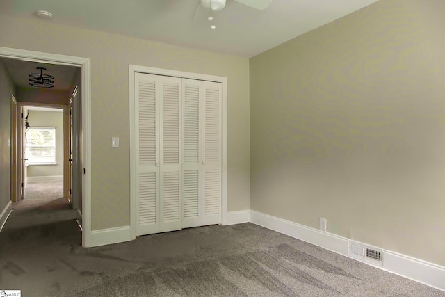 418 N Alabama Ave, Chesnee, SC 29323 - unfurnished bedroom featuring dark carpet, baseboards, a closet, and ceiling fan