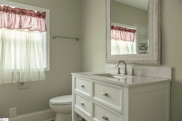 418 N Alabama Ave, Chesnee, SC 29323 - bathroom with vanity, toilet, healthy amount of natural light, and baseboards