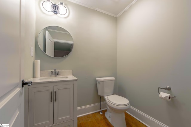 418 N Alabama Ave, Chesnee, SC 29323 - bathroom with toilet, wood finished floors, vanity, crown molding, and baseboards