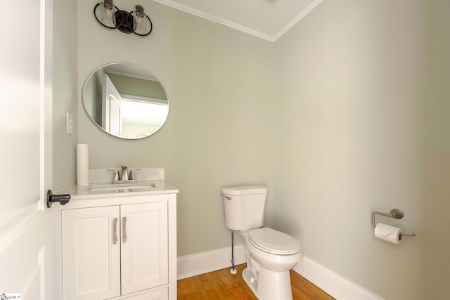 418 N Alabama Ave, Chesnee, SC 29323 - bathroom with toilet, vanity, ornamental molding, wood finished floors, and baseboards