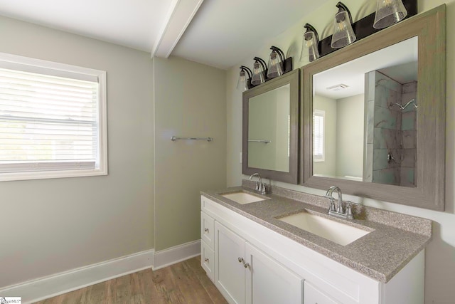 418 N Alabama Ave, Chesnee, SC 29323 - bathroom with double vanity, wood finished floors, baseboards, beam ceiling, and a shower
