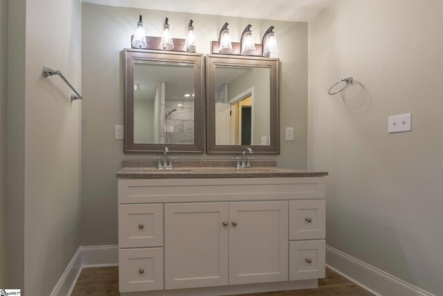 418 N Alabama Ave, Chesnee, SC 29323 - full bath with double vanity, baseboards, and wood finished floors