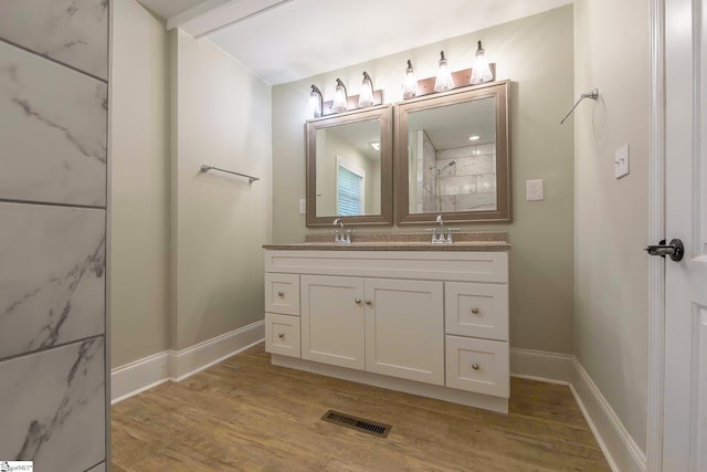 418 N Alabama Ave, Chesnee, SC 29323 - full bathroom featuring double vanity, wood finished floors, a marble finish shower, and baseboards