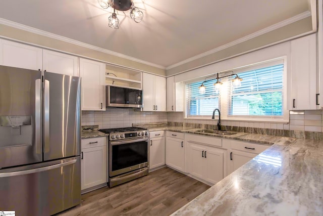 418 N Alabama Ave, Chesnee, SC 29323 - kitchen with stainless steel appliances, a sink, open shelves, white cabinets, and crown molding