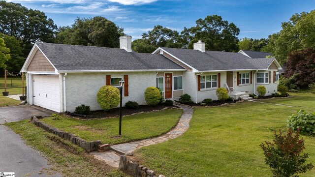 418 N Alabama Ave, Chesnee, SC 29323 - ranch-style home featuring a chimney, asphalt driveway, brick siding, a garage, and roof with shingles