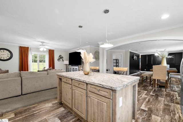 105 Penson Rd, Honea Path, SC 29654 - kitchen featuring open floor plan, ornamental molding, dark wood finished floors, arched walkways, and a center island