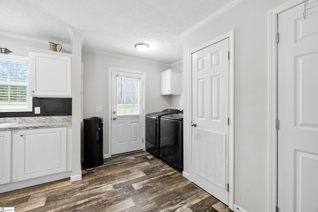 105 Penson Rd, Honea Path, SC 29654 - washroom with cabinet space, washer and clothes dryer, dark wood-type flooring, ornamental molding, and a textured ceiling