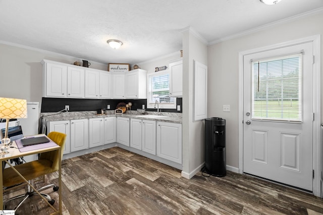 105 Penson Rd, Honea Path, SC 29654 - kitchen with crown molding, dark wood finished floors, white cabinetry, light countertops, and a sink