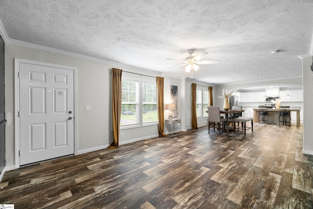 105 Penson Rd, Honea Path, SC 29654 - foyer featuring arched walkways, dark wood-style flooring, ceiling fan, crown molding, and a textured ceiling