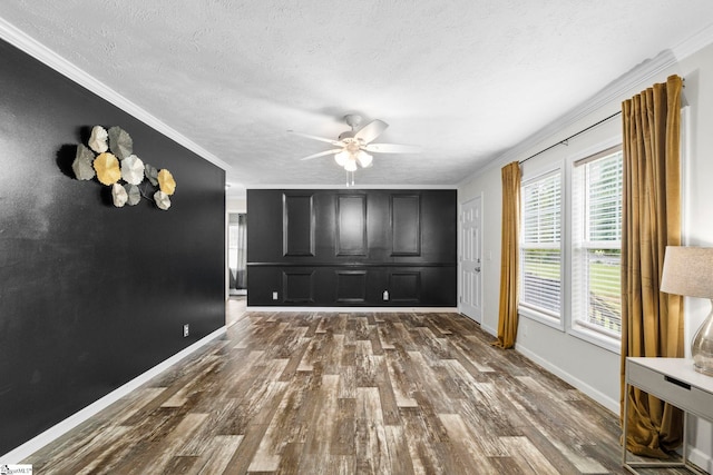 105 Penson Rd, Honea Path, SC 29654 - unfurnished living room with a ceiling fan, crown molding, dark wood finished floors, baseboards, and a textured ceiling