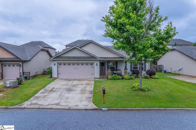 653 Chartwell Dr, Greer, SC 29650 - craftsman-style house with concrete driveway, a front yard, a garage, and covered porch