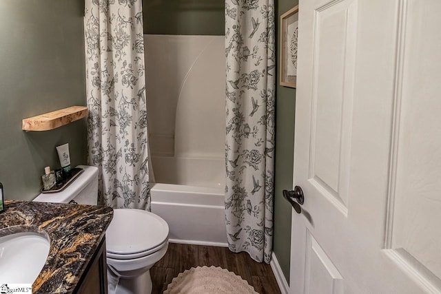 653 Chartwell Dr, Greer, SC 29650 - full bathroom featuring toilet, wood finished floors, shower / bathtub combination with curtain, vanity, and baseboards