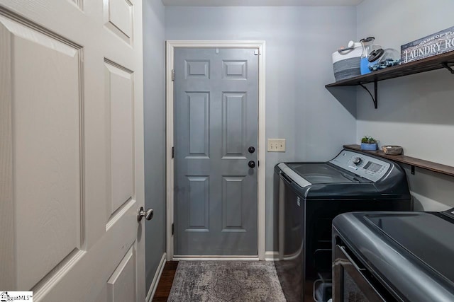 653 Chartwell Dr, Greer, SC 29650 - laundry room with washing machine and clothes dryer, baseboards, and dark wood-style floors