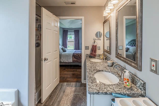 653 Chartwell Dr, Greer, SC 29650 - ensuite bathroom featuring wood finished floors and double vanity