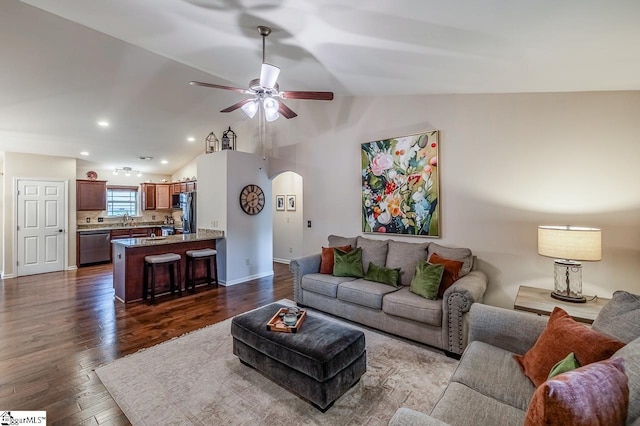 653 Chartwell Dr, Greer, SC 29650 - living room featuring arched walkways, dark wood finished floors, lofted ceiling, ceiling fan, and baseboards