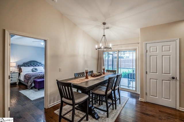 653 Chartwell Dr, Greer, SC 29650 - dining room featuring a chandelier, dark wood-type flooring, baseboards, and vaulted ceiling