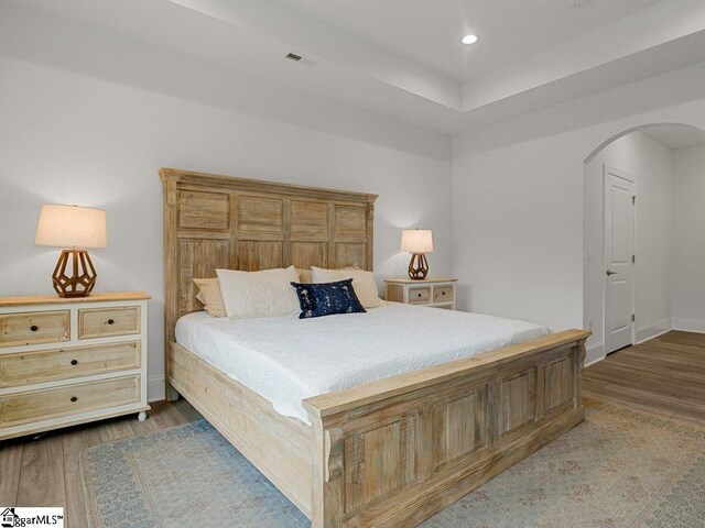 115 Harbor Master Ln, Taylors, SC 29687 - bedroom featuring arched walkways, wood finished floors, baseboards, and recessed lighting