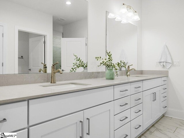 115 Harbor Master Ln, Taylors, SC 29687 - bathroom featuring double vanity, marble look tile flooring, recessed lighting, and baseboards