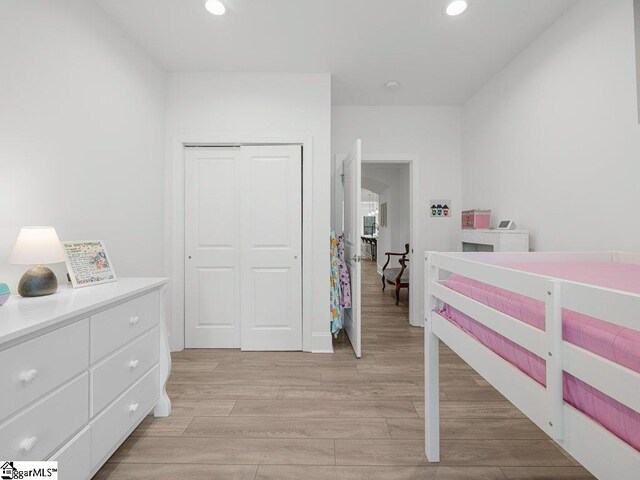 115 Harbor Master Ln, Taylors, SC 29687 - bedroom with recessed lighting, light wood-style floors, a closet, and baseboards