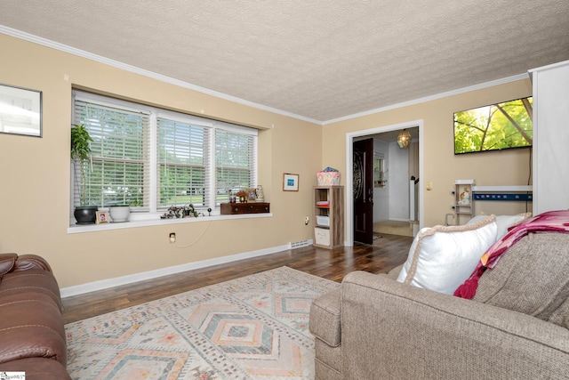 208 S Severn Cir, Easley, SC 29642 - living area featuring wood finished floors, healthy amount of natural light, a textured ceiling, crown molding, and baseboards