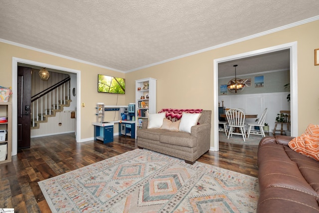 208 S Severn Cir, Easley, SC 29642 - living room featuring stairs, dark wood-type flooring, a chandelier, a textured ceiling, and ornamental molding