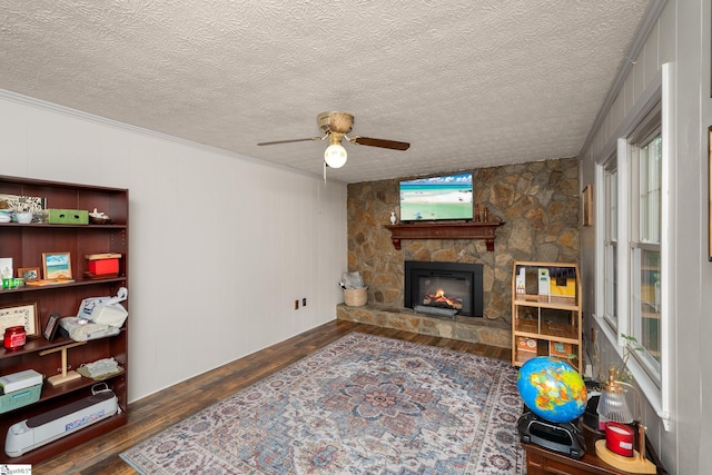 208 S Severn Cir, Easley, SC 29642 - living room featuring wood finished floors, ceiling fan, a fireplace, and a textured ceiling