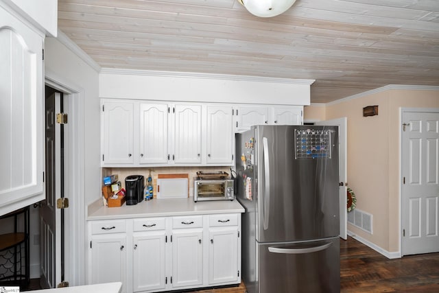 208 S Severn Cir, Easley, SC 29642 - kitchen with freestanding refrigerator, crown molding, white cabinets, wood ceiling, and dark wood-style flooring