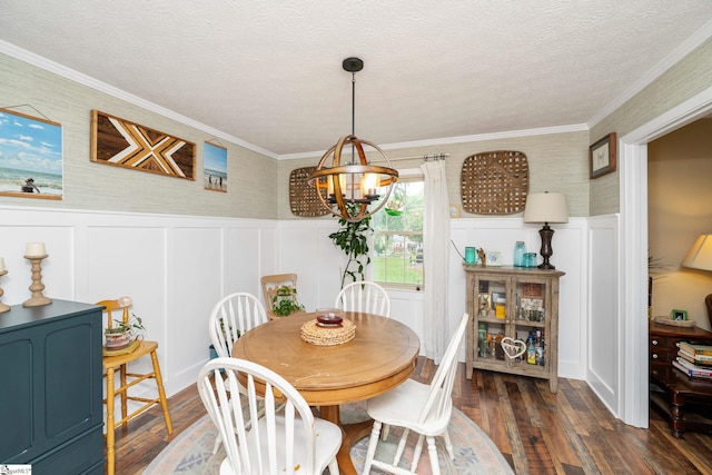 208 S Severn Cir, Easley, SC 29642 - dining space with a chandelier, dark wood-type flooring, ornamental molding, a wainscoted wall, and a decorative wall
