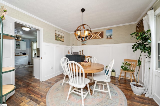 208 S Severn Cir, Easley, SC 29642 - dining space featuring a chandelier, dark wood-type flooring, a wainscoted wall, ornamental molding, and a decorative wall