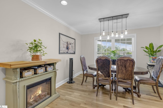121 Lowe Rd, Piedmont, SC 29673 - dining area featuring light wood-type flooring, baseboards, crown molding, a glass covered fireplace, and recessed lighting