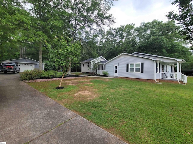 242 Lewis Rd, Williamston, SC 29697 - ranch-style house featuring covered porch, a front lawn, view of scattered trees, an outdoor structure, and a garage