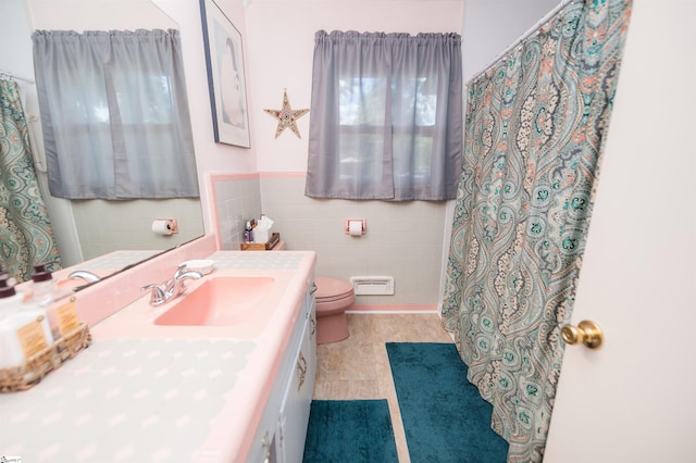 109 Kent Pl, Spartanburg, SC 29307 - bathroom featuring tile walls, vanity, toilet, a wainscoted wall, and a shower with curtain