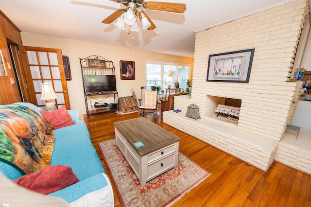 109 Kent Pl, Spartanburg, SC 29307 - living room with wood finished floors, ceiling fan, and a brick fireplace