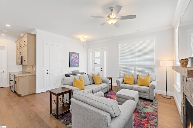 1 Winding Rock Rd, Simpsonville, SC 29680 - living area with a stone fireplace, a ceiling fan, light wood-style flooring, crown molding, and recessed lighting