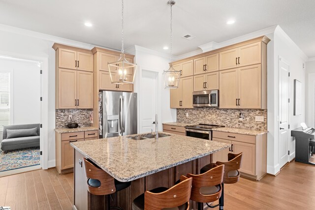 1 Winding Rock Rd, Simpsonville, SC 29680 - kitchen with appliances with stainless steel finishes, a sink, crown molding, backsplash, and a kitchen breakfast bar