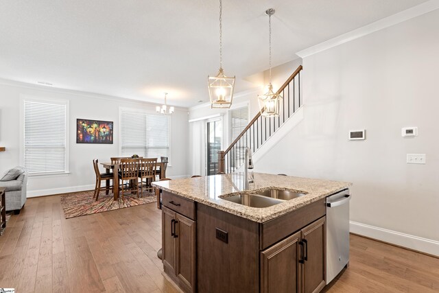 1 Winding Rock Rd, Simpsonville, SC 29680 - kitchen with a sink, stainless steel dishwasher, a chandelier, crown molding, and light wood-type flooring