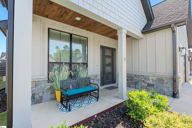 1 Winding Rock Rd, Simpsonville, SC 29680 - entrance to property with a porch, board and batten siding, a shingled roof, and stone siding
