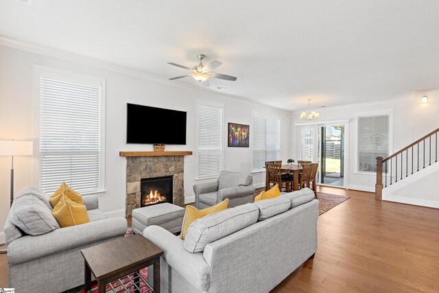 1 Winding Rock Rd, Simpsonville, SC 29680 - living area with a ceiling fan, wood finished floors, a chandelier, ornamental molding, and stairway