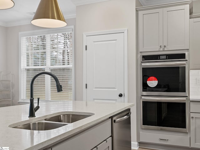 4427 Storehouse Run, Boiling Springs, SC 29316 - kitchen with appliances with stainless steel finishes, crown molding, a sink, light stone counters, and healthy amount of natural light