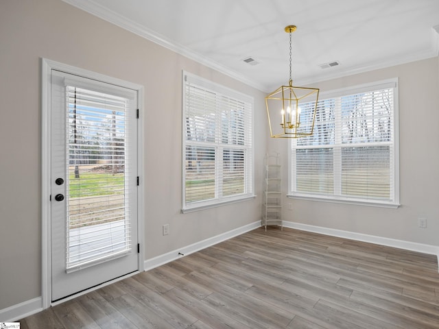 4427 Storehouse Run, Boiling Springs, SC 29316 - unfurnished dining area with a chandelier, crown molding, plenty of natural light, light wood-style floors, and baseboards