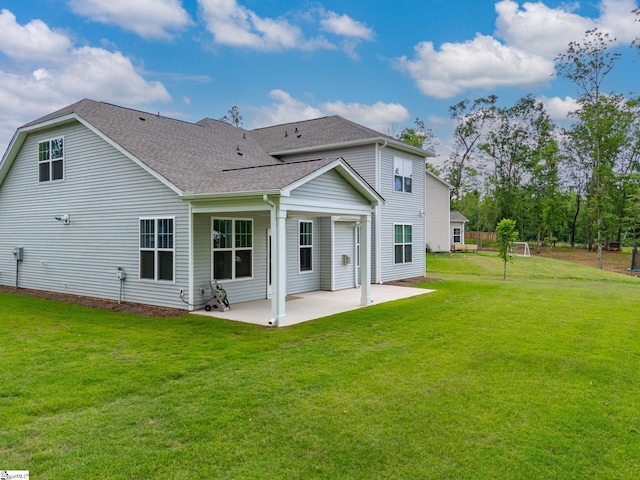 4427 Storehouse Run, Boiling Springs, SC 29316 - back of property featuring a shingled roof, a patio area, and a yard