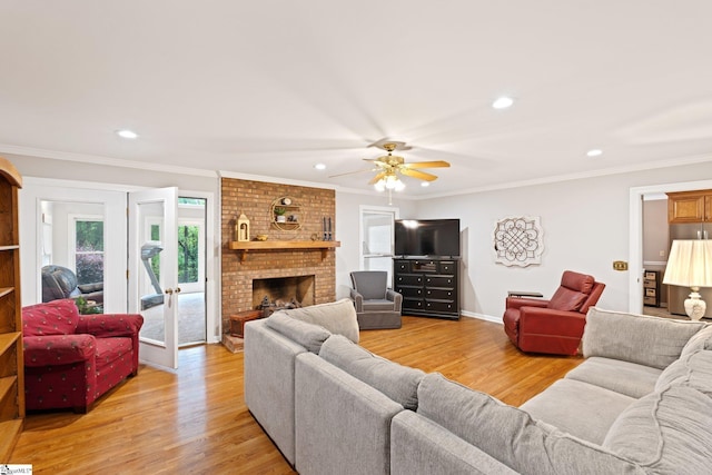 8 Nigh Oak Trce, Greer, SC 29651 - living area with light wood-type flooring, recessed lighting, a ceiling fan, crown molding, and a fireplace