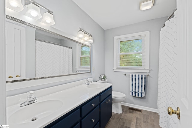 8 Nigh Oak Trce, Greer, SC 29651 - full bathroom with double vanity, toilet, baseboards, wood finished floors, and a shower with curtain