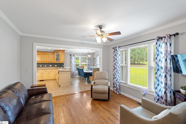 8 Nigh Oak Trce, Greer, SC 29651 - living room featuring a ceiling fan, light wood-type flooring, baseboards, crown molding, and a chandelier